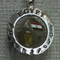 silver keychain with Egyptian symbols
